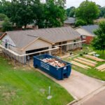 dumpster parked in front of house in Shreveport