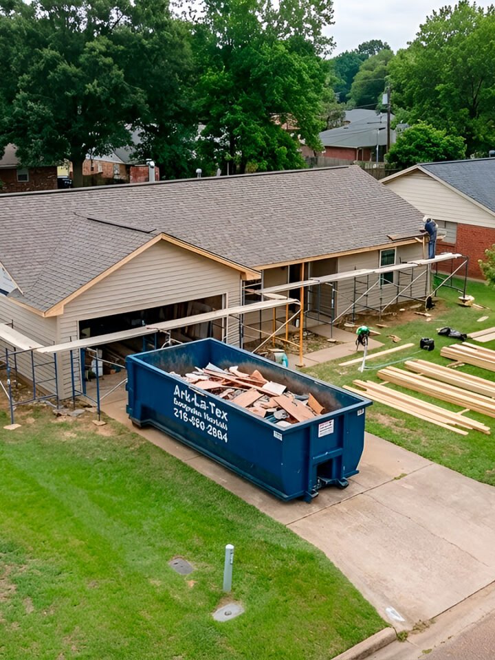 dumpster parked in front of house in Shreveport
