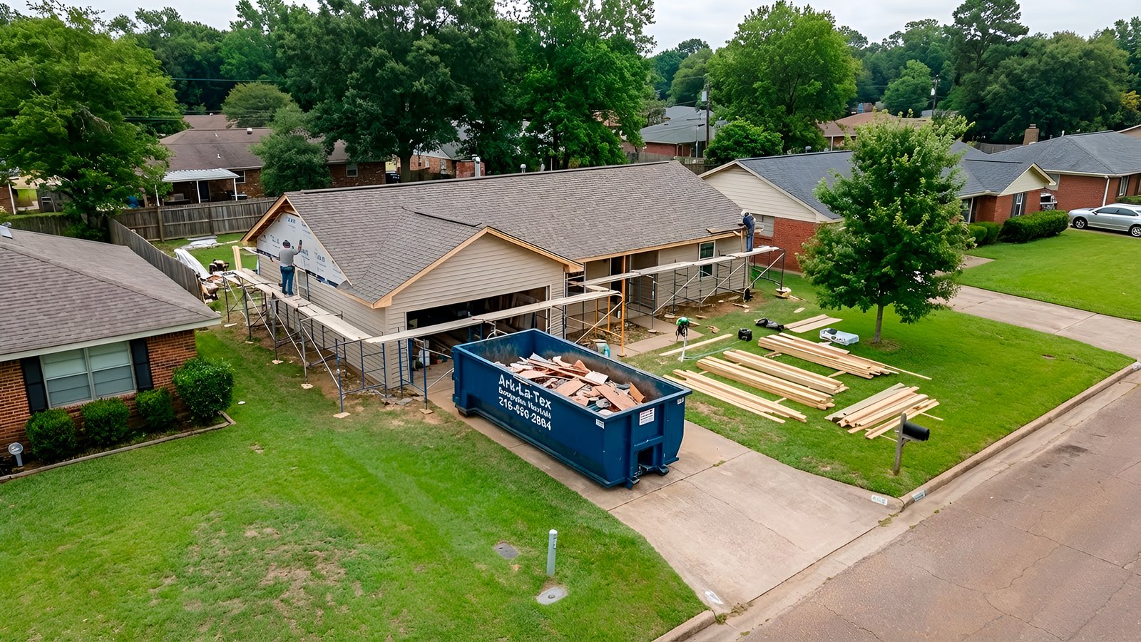 dumpster parked in front of house in Shreveport